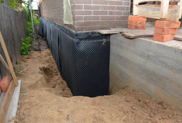 Happy homeowners after waterproofing job in North Brunswick